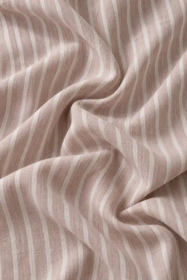 Close-up of striped shirt fabric showing fine woven texture, natural folds, lightweight material structure, and detailed textile surface.